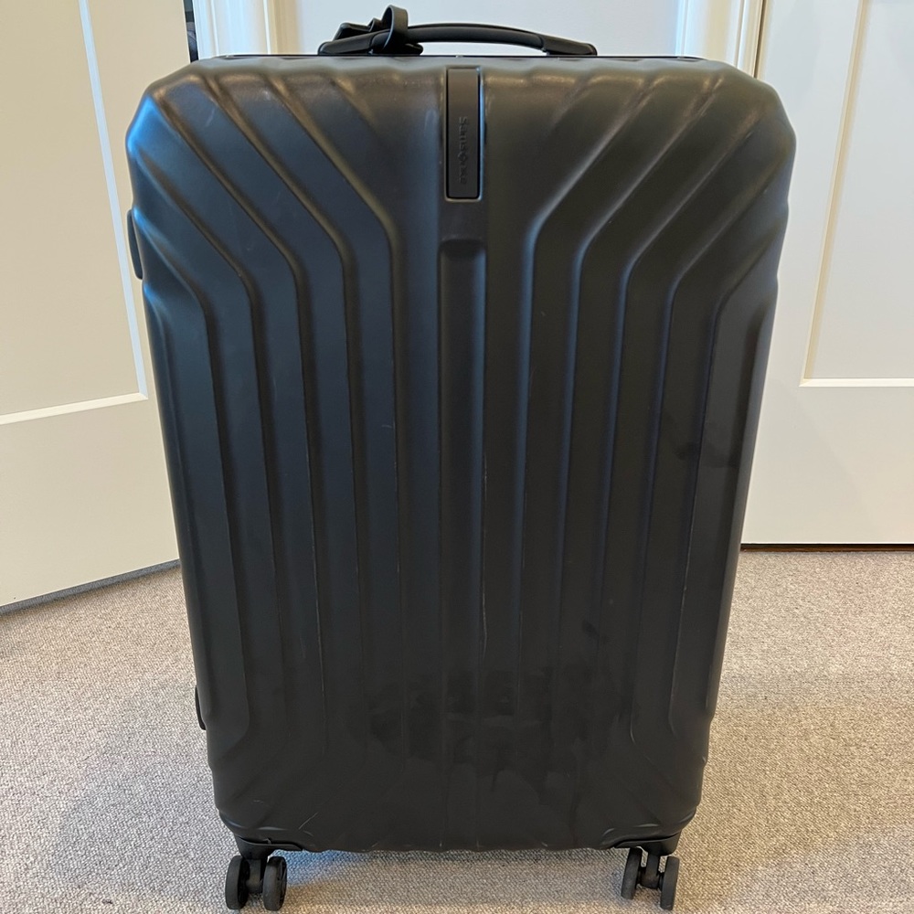 Samsonite hard suitcase with locks. Barely used.